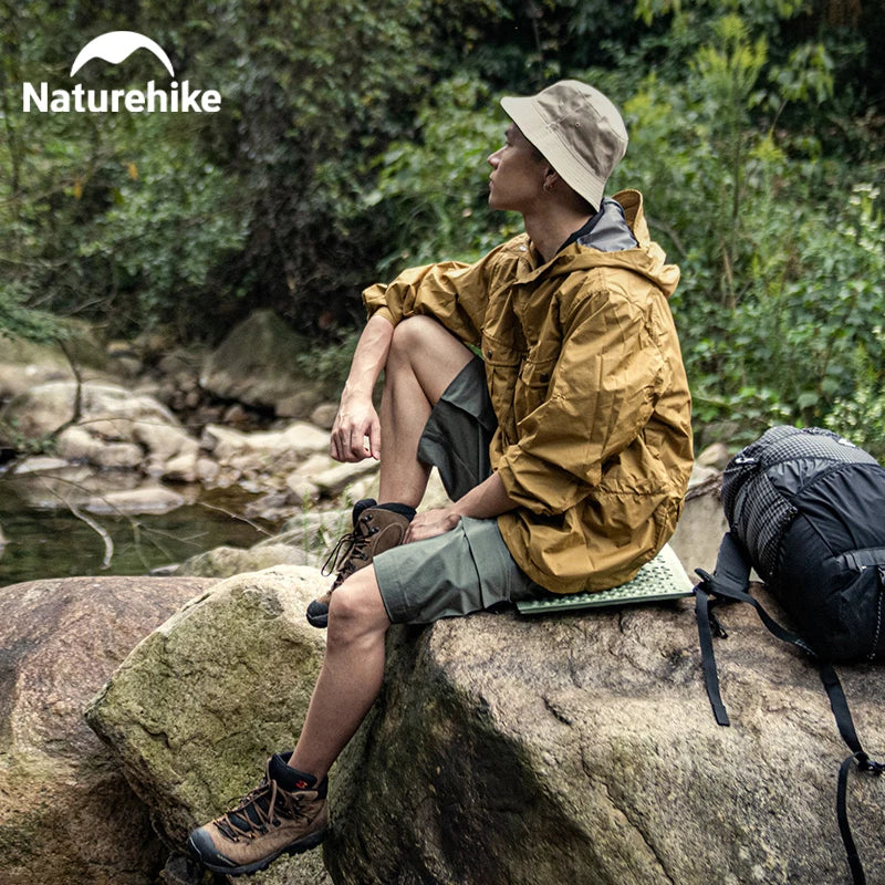 Camping mat clipped to a backpack