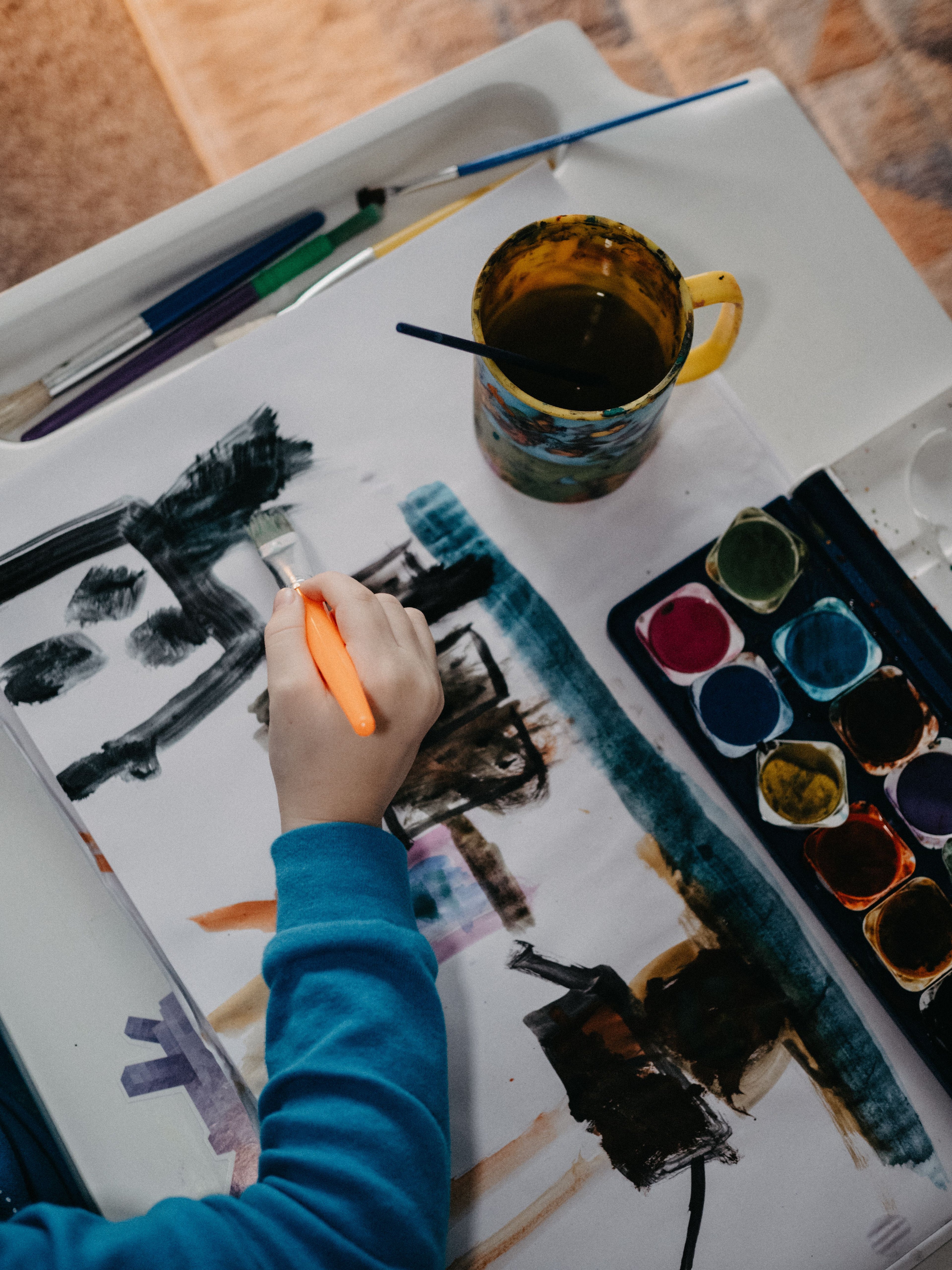 Child painting with water — mess-free creative play