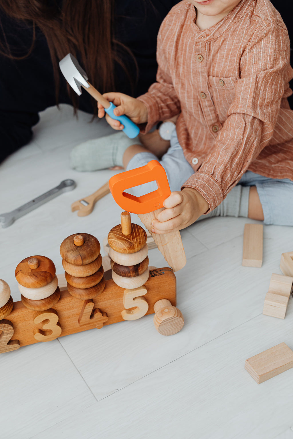 Child exploring educational learning toys independently