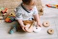 Quiet play time with developmental toys on a play mat